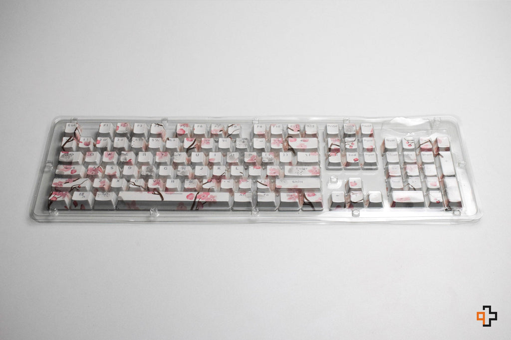 Sakura áttetsző OEM profilú ABS double-shot keycap szett